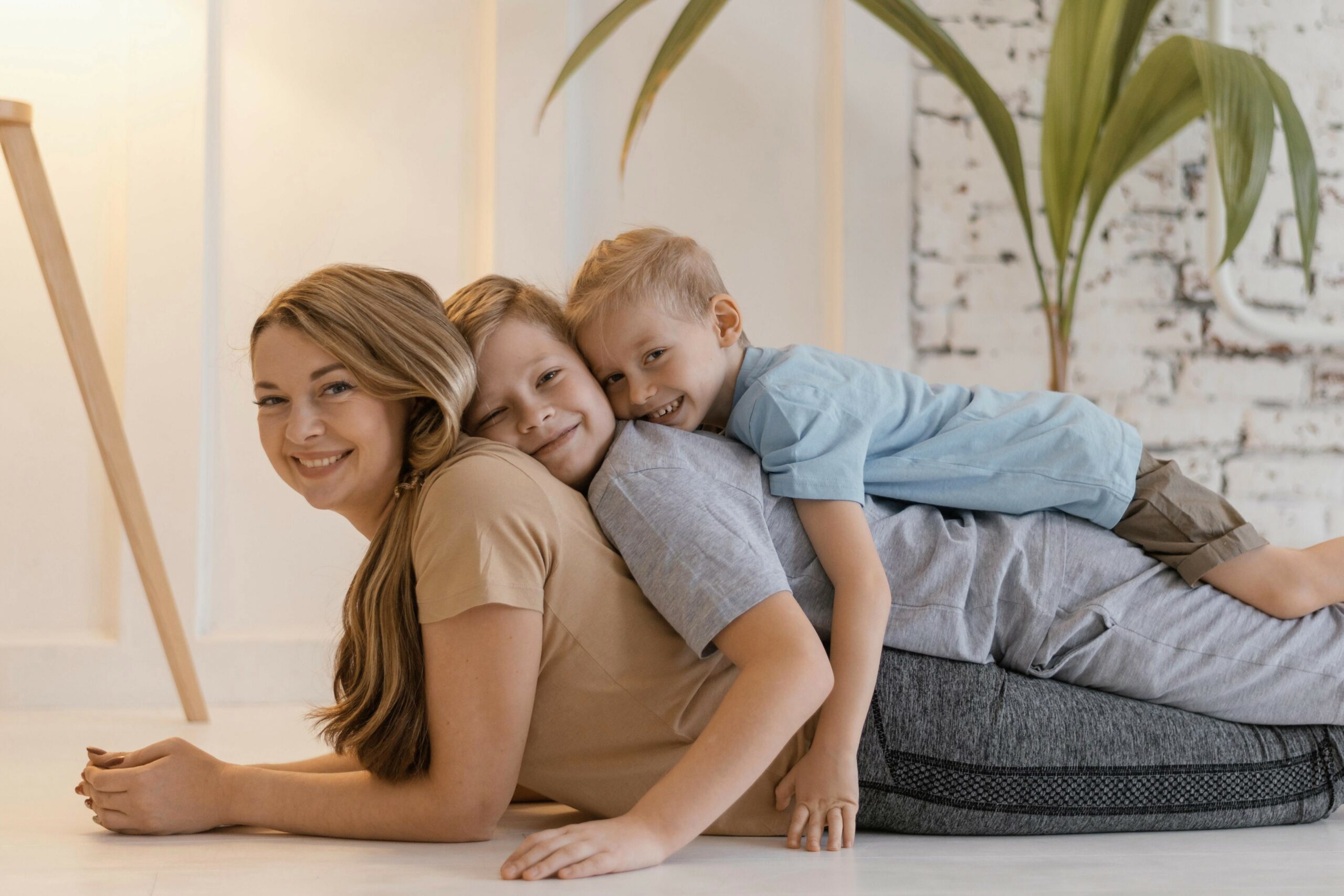 medium shot kids laying smiley woman